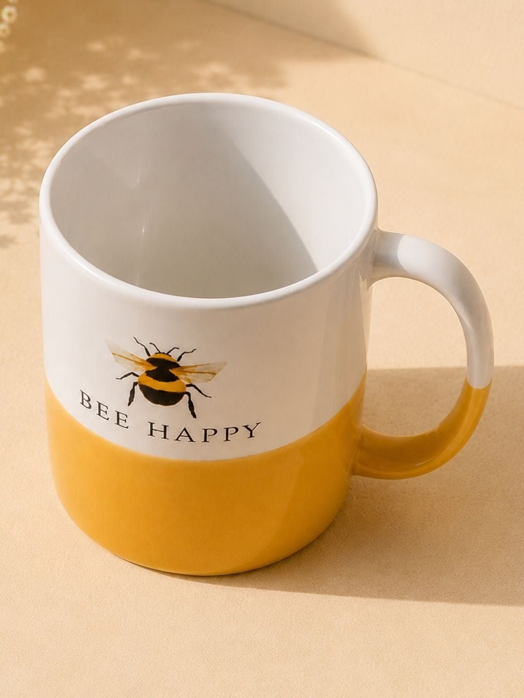 Yellow ceramic bee-themed mug for coffee, tea, and hot chocolate