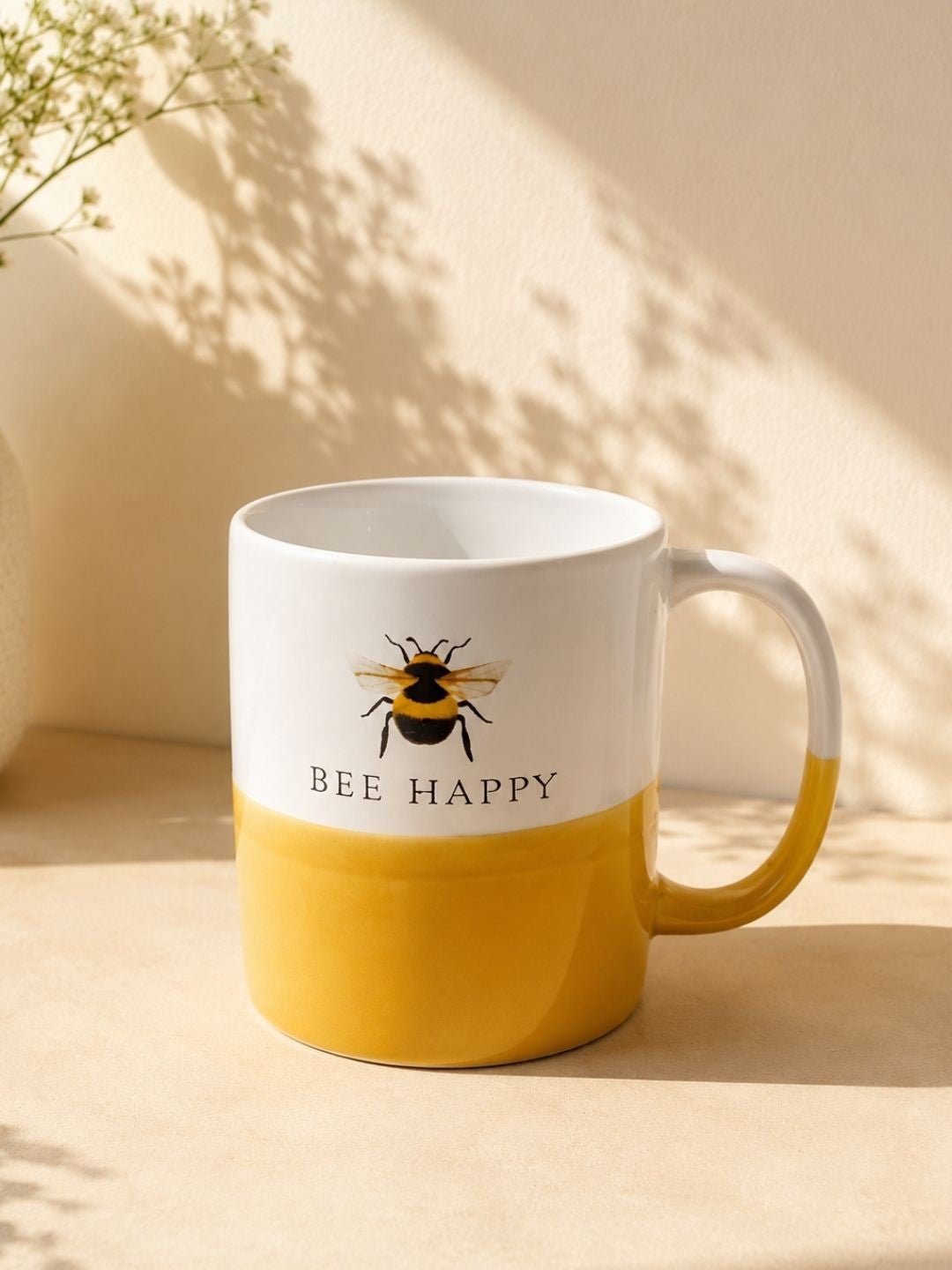 Bee Happy ceramic  mug with bumblebee design and yellow two-tone finish