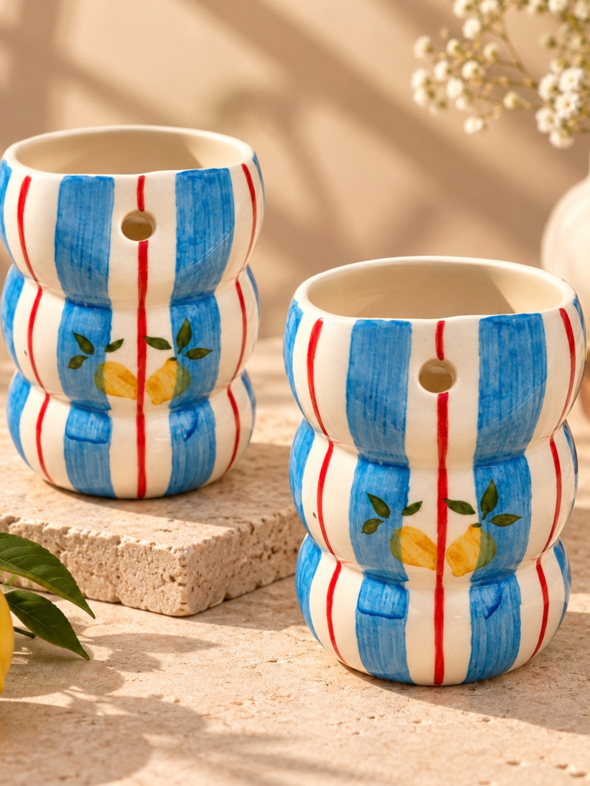 Pair of blue stripe lemon bubble tumblers on stone, handmade in Khurja
