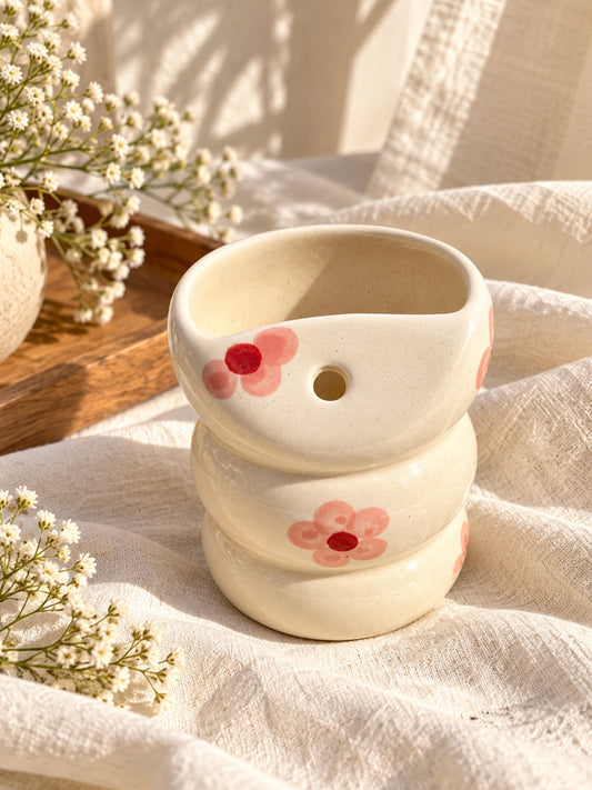Pink flower ceramic bubble tumbler showing built-in straw hole