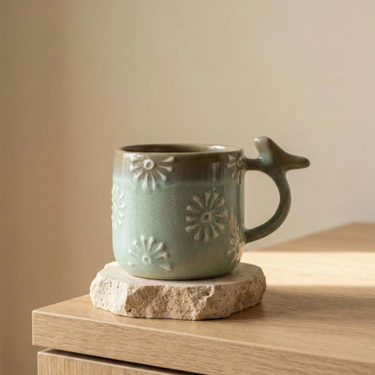 Handcrafted Bird Handle Ceramic Mug – Meadow Green Daisy Motif | Handcrafted by CHAAK DESIGN